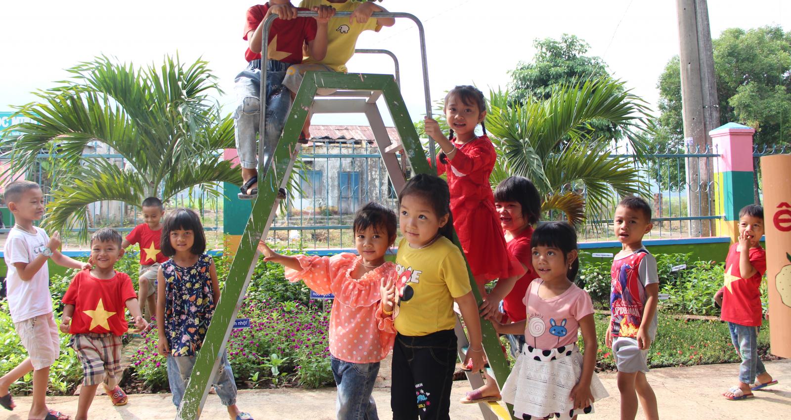 A group of children on playground equipment