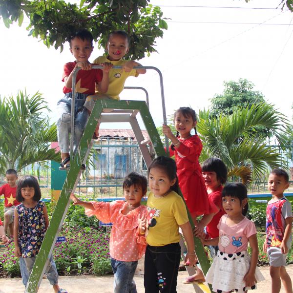 A group of children on playground equipment