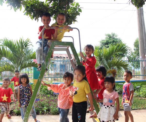 A group of children on playground equipment